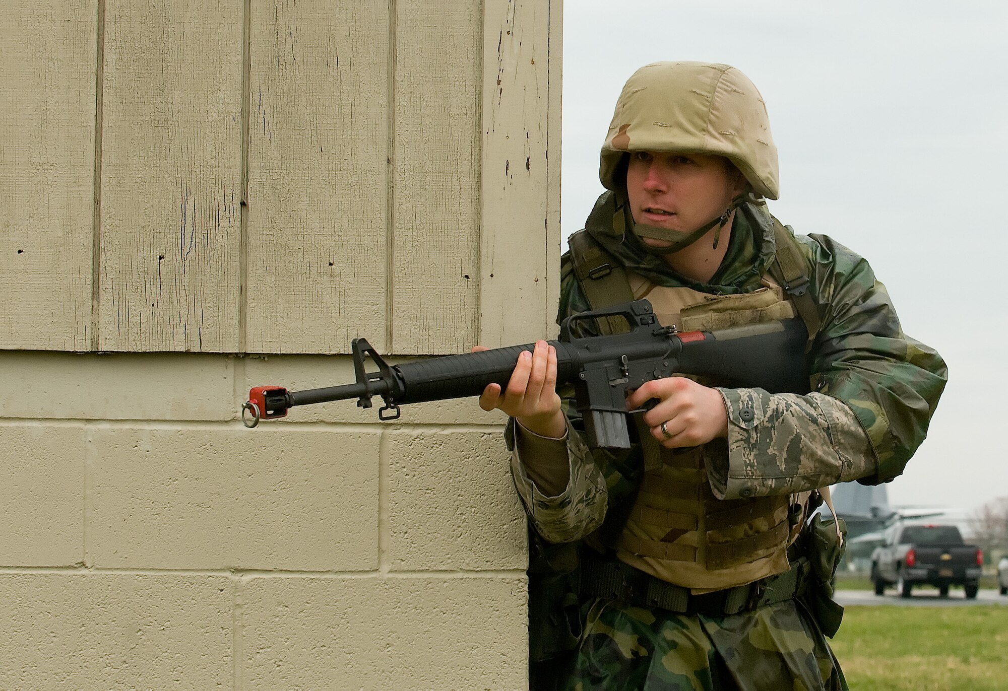 Senior Airman Frank Brooks, 436th Aerial Port Squadron, clears a corner to ensure the area is safe for his fire-team to continue the mission April 8, 2011, in Base X at Dover Air Force Base, Del. This was part of Expeditionary Combat Skills Training, which is a prerequisite for deployment.  (U.S. Air Force photo by Steve Kotecki)