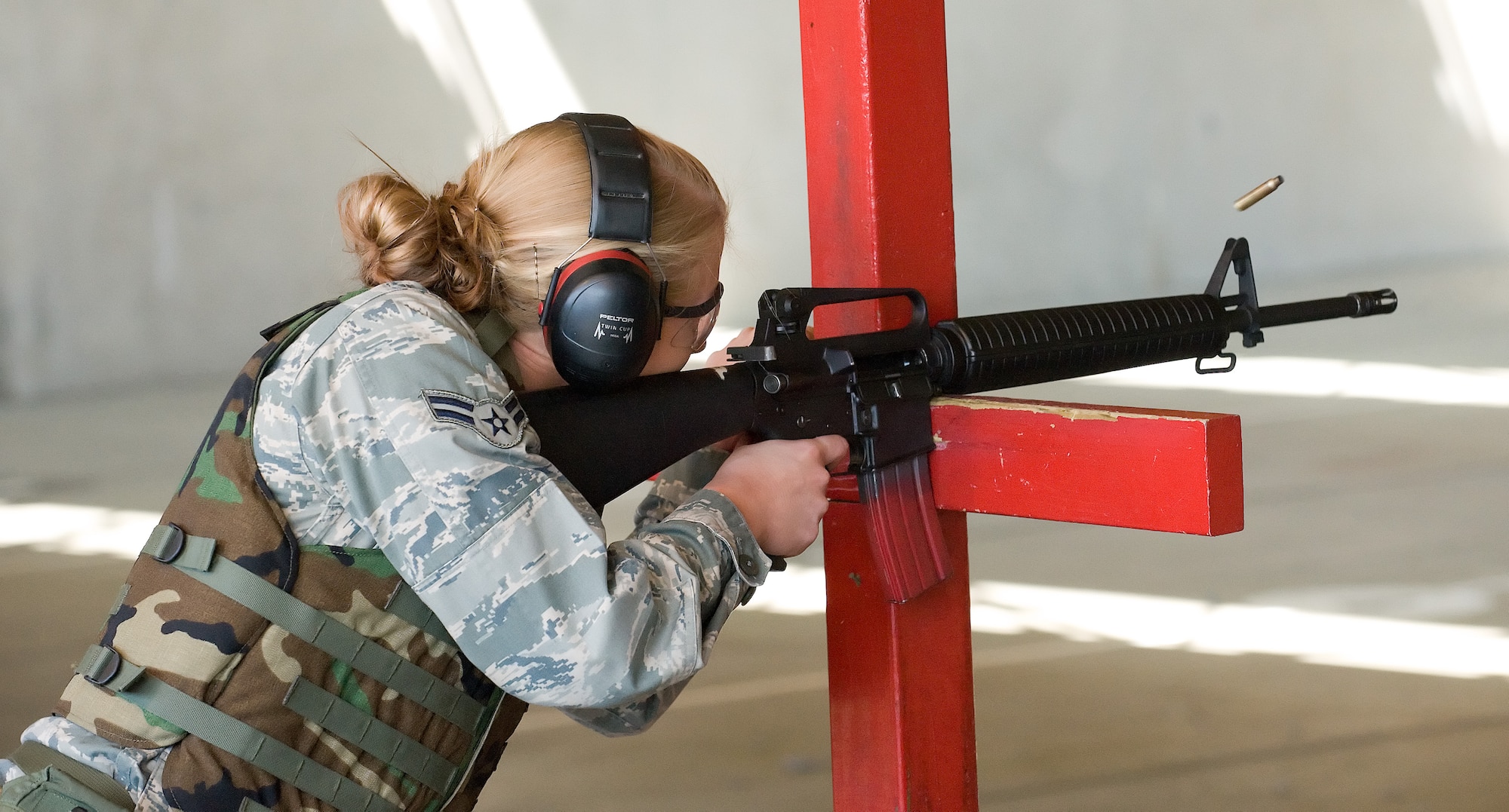 Airman 1st Class Rhonda Russell, 436th Medical Support Squadron, fires an M-16A2 at the Combat Arms Training and Maintenance firing range April 6, 2011, at Dover Air Force Base, Del. This was part of Expeditionary Combat Skills Training, which is a prerequisite for deployment.   (U.S. Air Force photo by Airman 1st Class Jacob Morgan)
