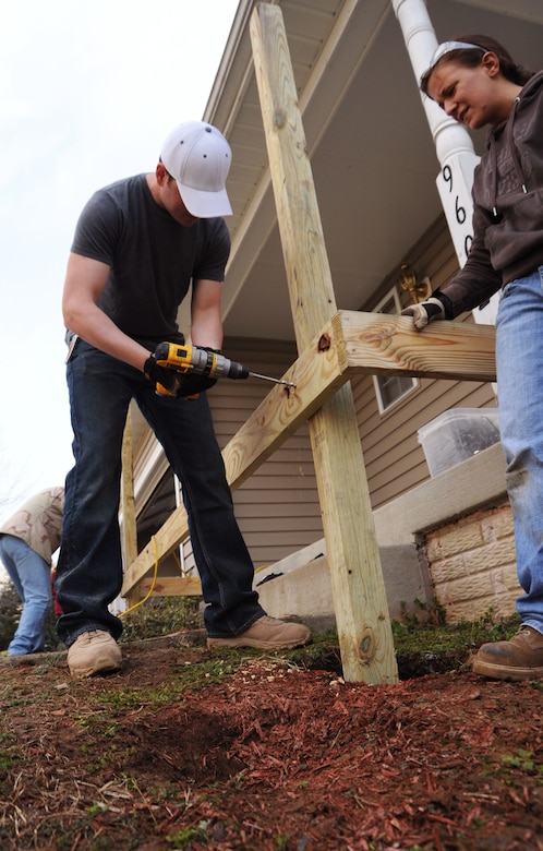 Volunteers from Joint Base Andrews construct a wheelchair ramp at the Callahan residence in Upper Marlboro, Md., April 2.  In conjunction with Christmas in April * Prince George's County, volunteers helped make the Callahan residence wheelchair accessible.  Daniel Callahan, 19,  was paralyzed in an automobile accident Jan. 23 on the Capital Beltway.  The accident also claimed the life of his 21 year old brother, David.  The boys' mother works for the Judge Advocate General at the Washington Navy Yard on Joint Base Andrews. (U.S. Air Force Photo by Senior Airman Torey Griffith.)(Released)