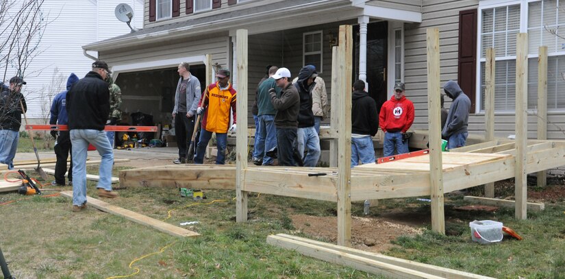 Volunteers from Joint Base Andrews construct a wheelchair ramp at the Callahan residence in Upper Marlboro, Md., April 2.  In conjunction with Christmas in April * Prince George's County, volunteers helped make the Callahan residence wheelchair accessible.  Daniel Callahan, 19,  was paralyzed in an automobile accident Jan. 23 on the Beltway.  The accident also claimed the life of his 21 year old brother, David.  The boys' mother works for the Judge Advocate General at the Washington Navy Yard on Joint Base Andrews. (U.S. Air Force Photo by Senior Airman Torey Griffith.)(Released)