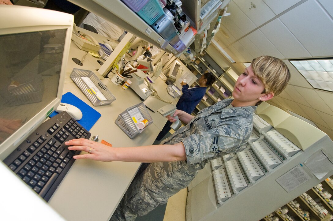 Airman 1st Class Emily Burns, 779th Medical Support Squadron pharmacy technician, verifies a prescription inside the main pharmacy at Malcolm Grow Medical Center April 6. (Photo by Bobby Jones)