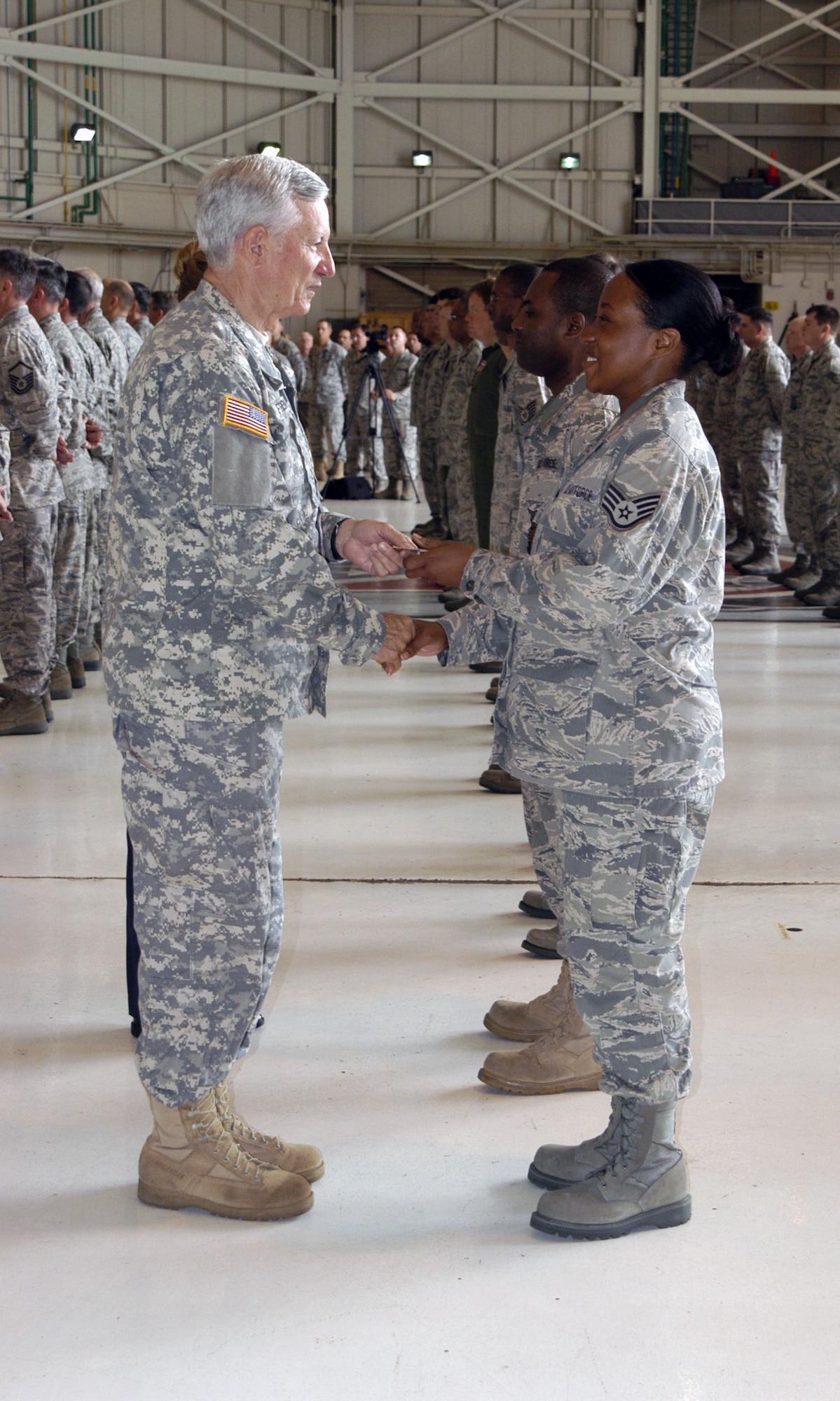 Mississippi Adjutant General Maj. Gen. William Freeman presents an ‘initial cadre’ patch to a staff sergeant assigned to the 286th Air Operations Group at Meridian Air National Guard Base, Miss.  The Adjutant General distributed one-of-a-kind patches to each member of the group during a stand-up ceremony held at the base April 8, 2011.  (U.S. Air Force photo by Lt. Col. Susan A. Romano)
