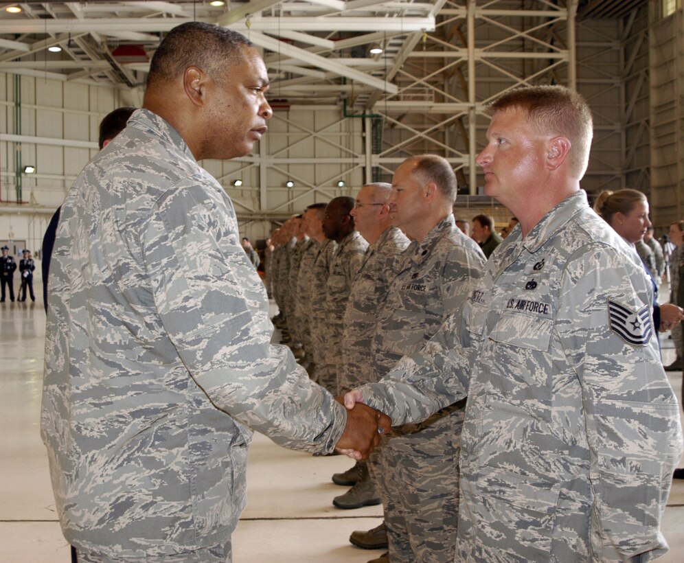 Maj. Gen. Garry C. Dean, Continental U.S. NORAD Region-1st Air Force (Air Forces Northern) commander presents an ‘initial cadre’ patch to a technical sergeant assigned to the 286th Air Operations Group at Meridian Air National Guard Base, Miss.  The commander distributed the one-of-a-kind patches to each member of the group during a stand-up ceremony held at the base April 8, 2011.  (U.S. Air Force photo by Lt. Col. Susan A. Romano)