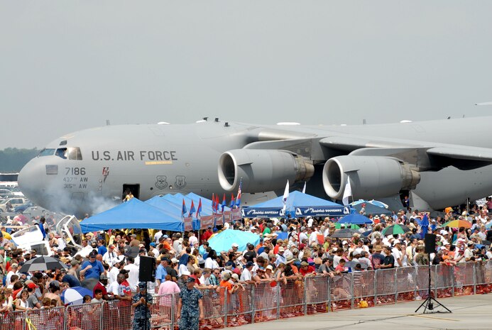 Nearly 80,000 people came out to the Charleston Air Expo 2011 April 9 at Joint Base Charleston, S.C.  Performances included the U.S. Thunderbirds, The Black Daggers, the U.S. Army Special Operations Command parachute demonstration team, Tora! Tora! Tora! and a dozen more aerial acts.  (U.S. Air Force photo/ Tech. Sgt. Chrissy Best)