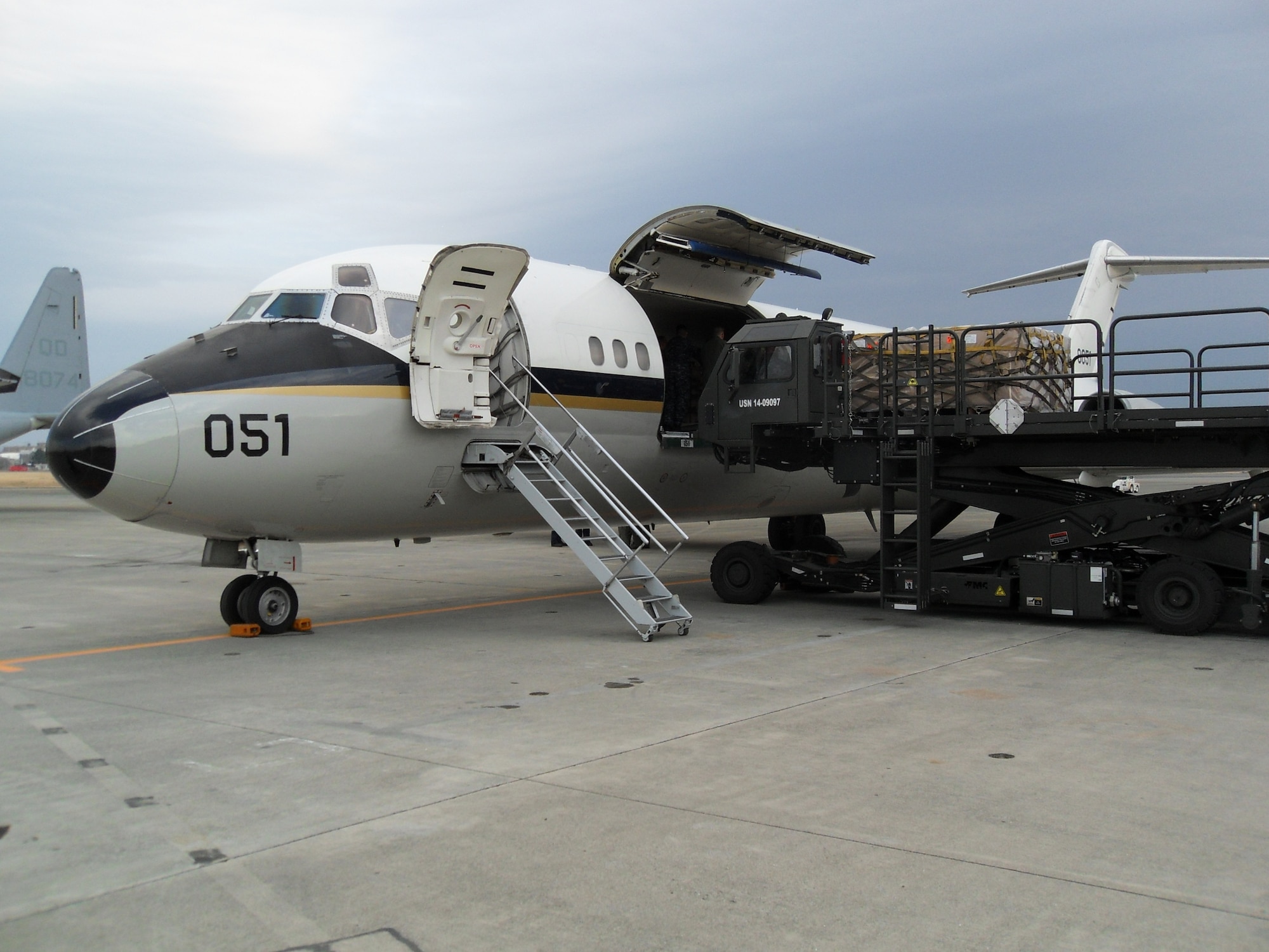 Aircrew from Navy Fleet Logistics Support Squadron 52 (VR-52), having recently completed their move to JB MDL, load food, water and medical supplies aboard their C-9B aircraft assisting with Operation Tomodachi HA/DR efforts in Japan. (U.S. Navy photo by J.P. Jones/Released)