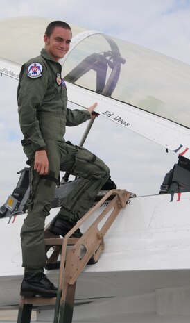 Ed Daes prepares to climb into a U.S Air Force Thunderbird F-16 Fighting Falcon aerial demonstration jet on Joint Base Charleston, S.C., April 8. Mr. Daes was recognized as a Hometown Hero and received an incentive flight after he raised more than $2,500 during a 75-day, cross-country trip on his bicycle for the Ronal McDonald House Charities. 
