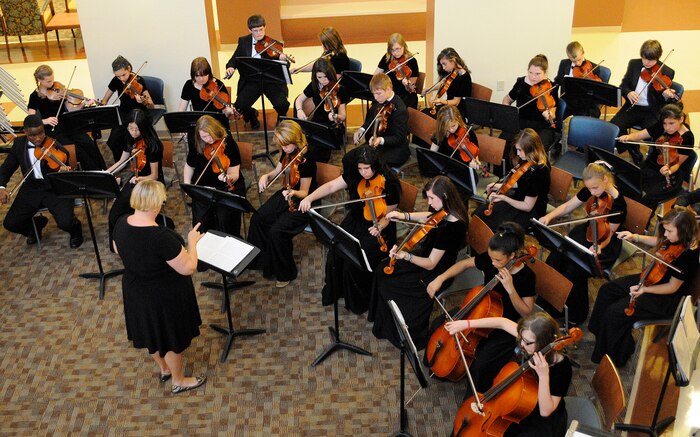 Thirty-one students from Sangaree Middle School Orchestra performed for patients at the Naval Health Clinic Charleston to show their appreciation for the military, April 6. The children played two, 30-minute sessions and provided a relaxing atmosphere for patients visiting the clinic. (U.S. Navy photo/Mass Communication Specialist 1st Class Jennifer Hudson)