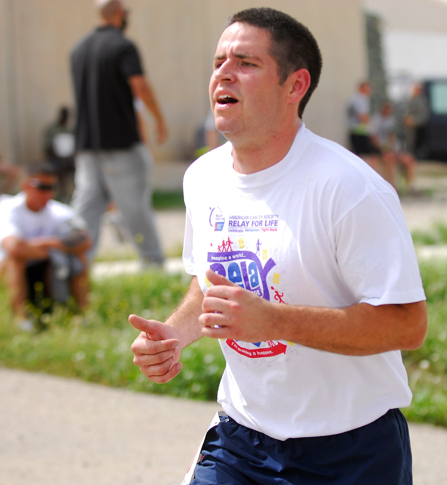 KIRKUK REGIONAL AIR BASE, Iraq -- Staff Sgt. Tyler McInturff, 321st Expeditionary Logistics Readiness Squadron, finishes the final leg of the Relay for Life 5K run/walk April 2. Sergeant McInturff, with the help of coworkers and the joint 5/6 Club, organized the event that rallied nearly 200 Americans and Iraqis to raise almost $4,000 for the American Cancer Society. (U.S. Air Force courtesy photo)