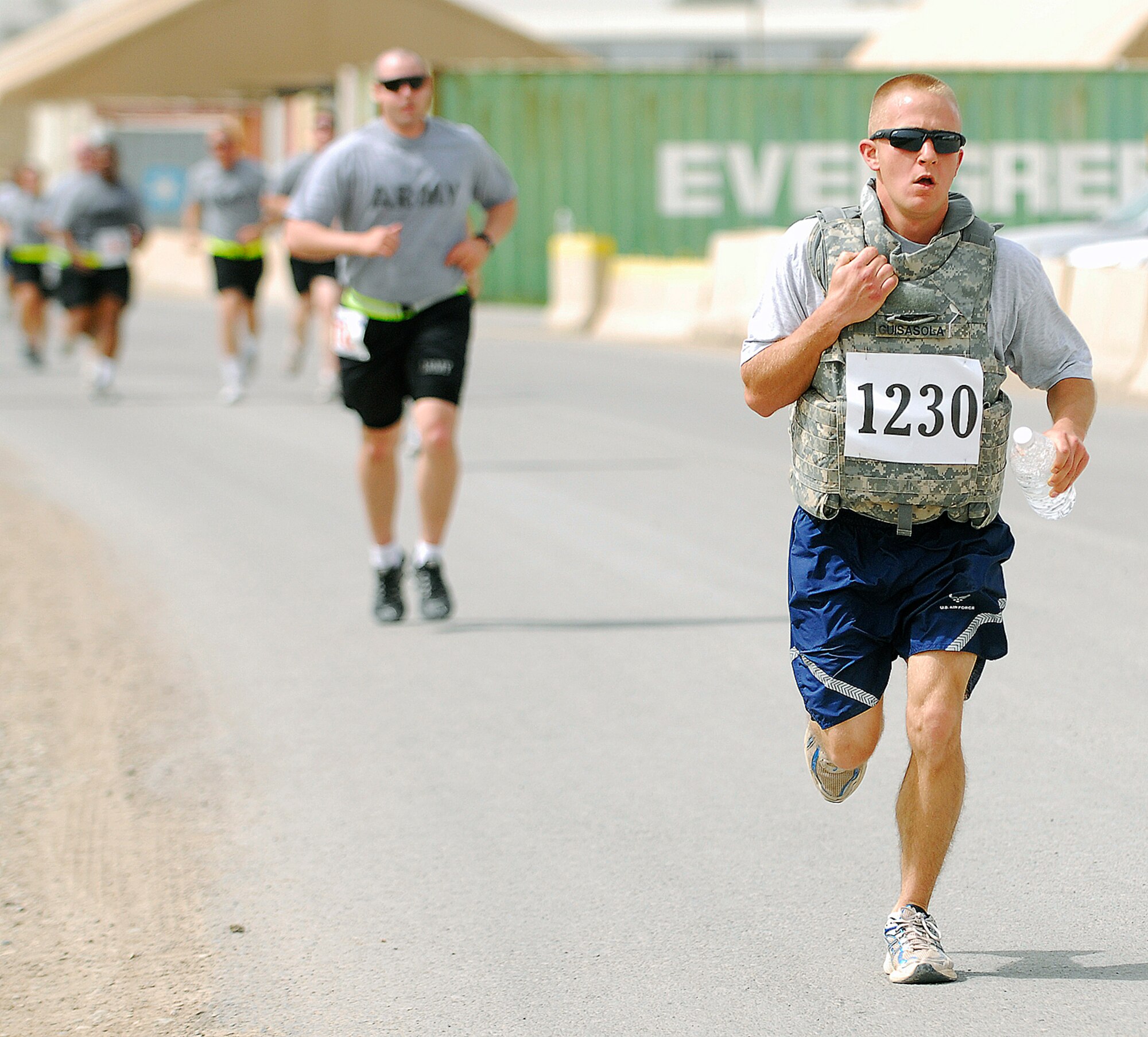 KIRKUK REGIONAL AIR BASE, Iraq -- Airman 1st Class Joshua Guisasola, 321st Expeditionary Logistics Readiness Squadron vehicle maintainer, makes his way toward the finish line during a Relay for Life 5K fundraiser run April 2. Nearly 200 people participated in the event raising more than $3,800 for the American Cancer Society. (U.S. Air Force courtesy photo)