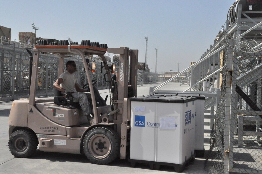 Staff Sgt. Ezra Whiteside, 60th Aerial Port Squadron aerial porter from Travis Air Force Base, Calif., moves a pallet of Army cargo at Bagram Airfield, Afghanistan, on April 11, 2011. The port squadron is the main ammunition supply point in Afghanistan and the Army is their main customer. (U.S. Air Force Photo/Staff Sgt. Patrick Harrower)