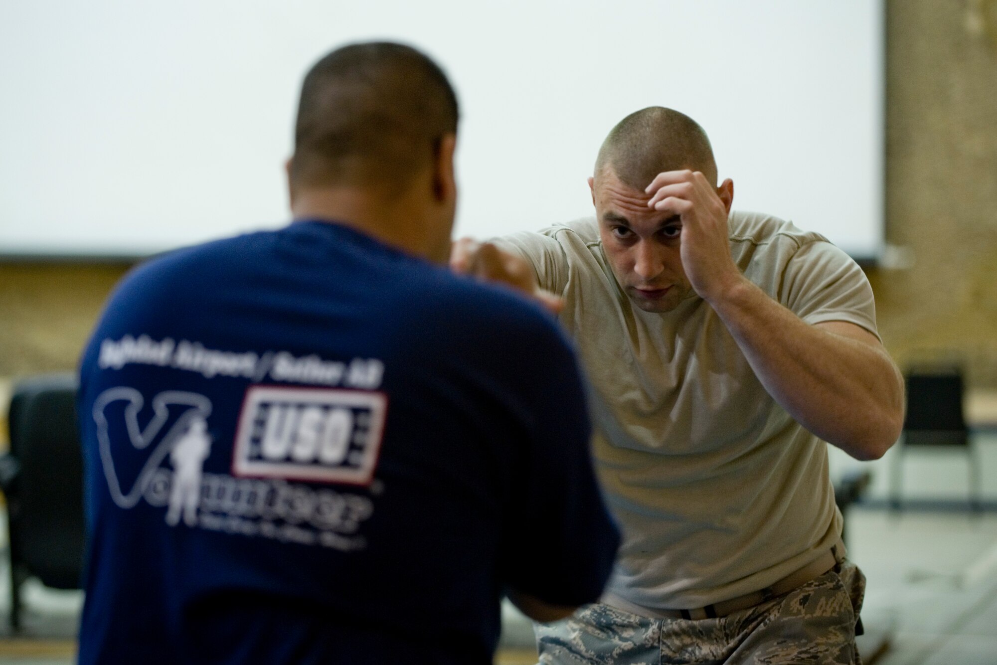 SATHER AIR BASE, Iraq -- Staff Sgt. Dario Trifone, 447th Expeditionary Security Forces Squadron, instructs an Iraqi airman on self defense techniques April 8. Members of the 447th ESFS trained Iraqi security forces airmen, ensuring weapons qualification and teaching defensive tactics, vehicle searches and other force protection measures. Sergeant Trifone is deployed from the 104th Security Forces Squadron, Barnes Air National Guard Base, Mass., and is a native of Southbridge, Mass. (U.S. Air Force photo by Staff Sgt. Levi Riendeau)