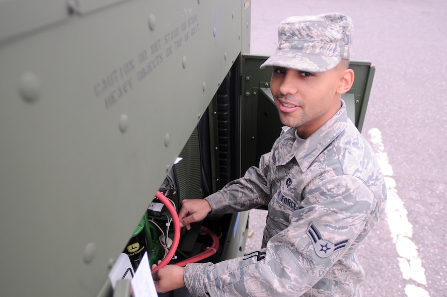 YOKOTA AIR BASE, Japan -- Airman 1st Class Matthew Struve, 374th Civil Engineer Squadron, checks a generator at Yokota Air Base, Japan, April 8, 2011. Airman Strave, a native of Sparta, Wis., provides Yokota AB with backup power and provides northern Japan with generators during Operation Tomodachi. (U.S. Air Force photo/Airman 1st Class Krystal M. Garrett) 