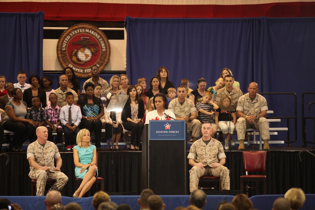 Michelle Obama, first lady of the United States of America, speaks to service members and members of the community during the Joining Forces campaign kick-off at the Goettge Memorial Field House aboard the base, April 13.