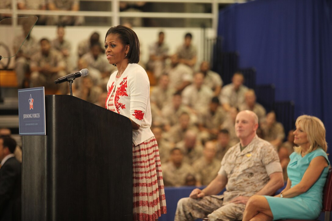 Michelle Obama, first lady of the United States of America, speaks to service members and members of the community during the Joining Forces campaign kick-off at the Goettge Memorial Field House aboard the base, April 13.