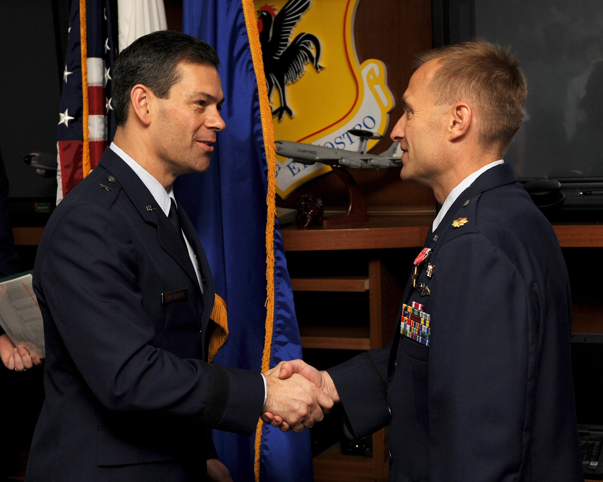 Brig. Gen. Ken Wilsbach, 18th Wing commander, presents the Bronze Star Medal to Maj. Daryl Pelletier, 18th Communications Squadron deputy commander, during a ceremony April 11. While assigned to a joint task force, Major Pelletier worked and trained with his Iraqi Army counterparts in support of Operation Iraqi Freedom and Operation New Dawn. (U.S. Air Force photo/Junko Kinjo)