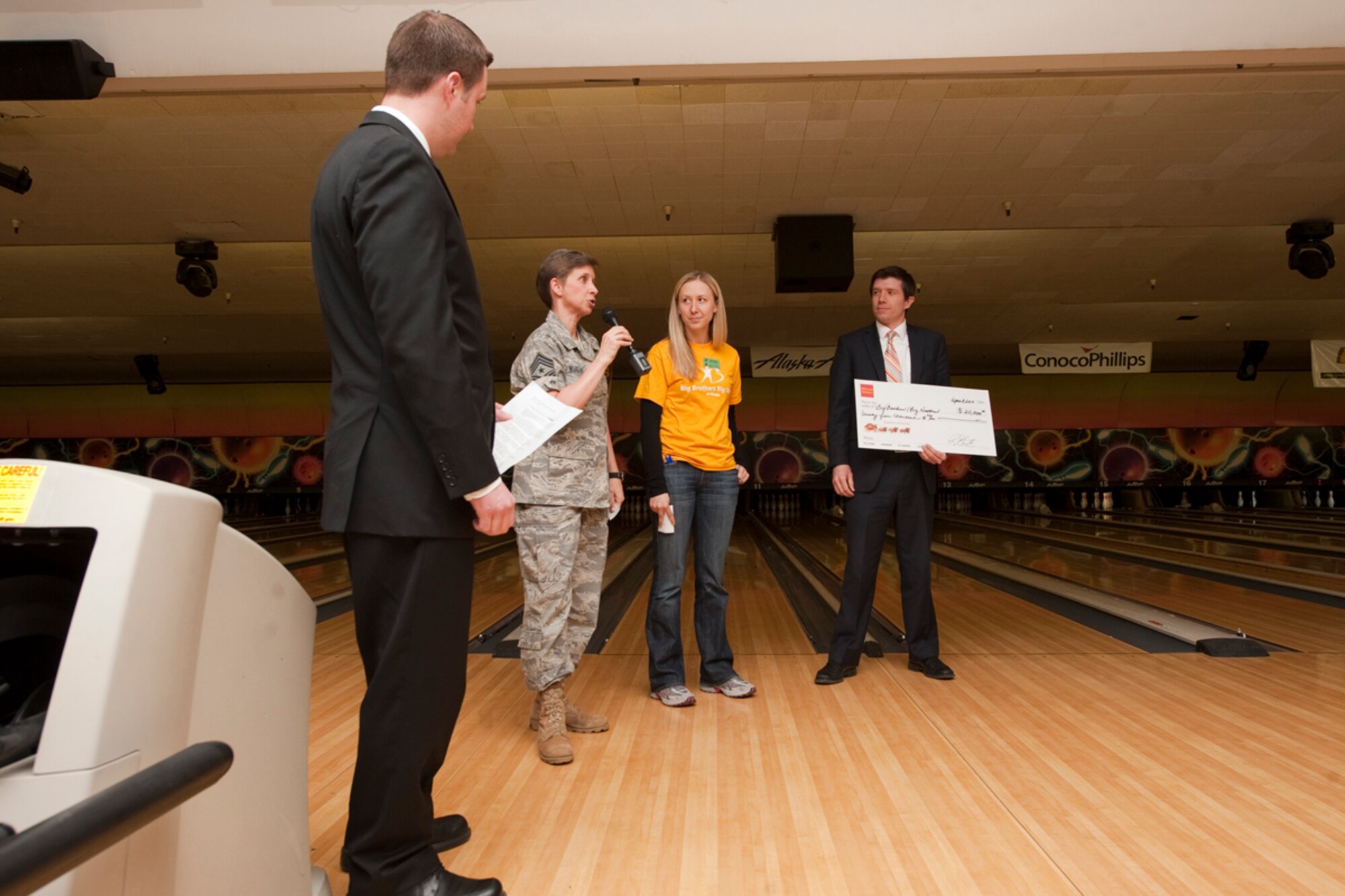 JOINT BASE ELMENDORF-RICHARDON, Alaska - Chief Master Sgt. Lisa Kuehnl, 673d Air Base Wing chief, delivers the opening remarks for Big Brothers Big Sisters of Alaska?s Bowl for Kids Sake at JBER?s Polar Bowl April 8. The event helped raised money for the organization and will be used toward children matched with BBBS. (U.S. Air Force photo/Senior Airman Christopher Gross)
