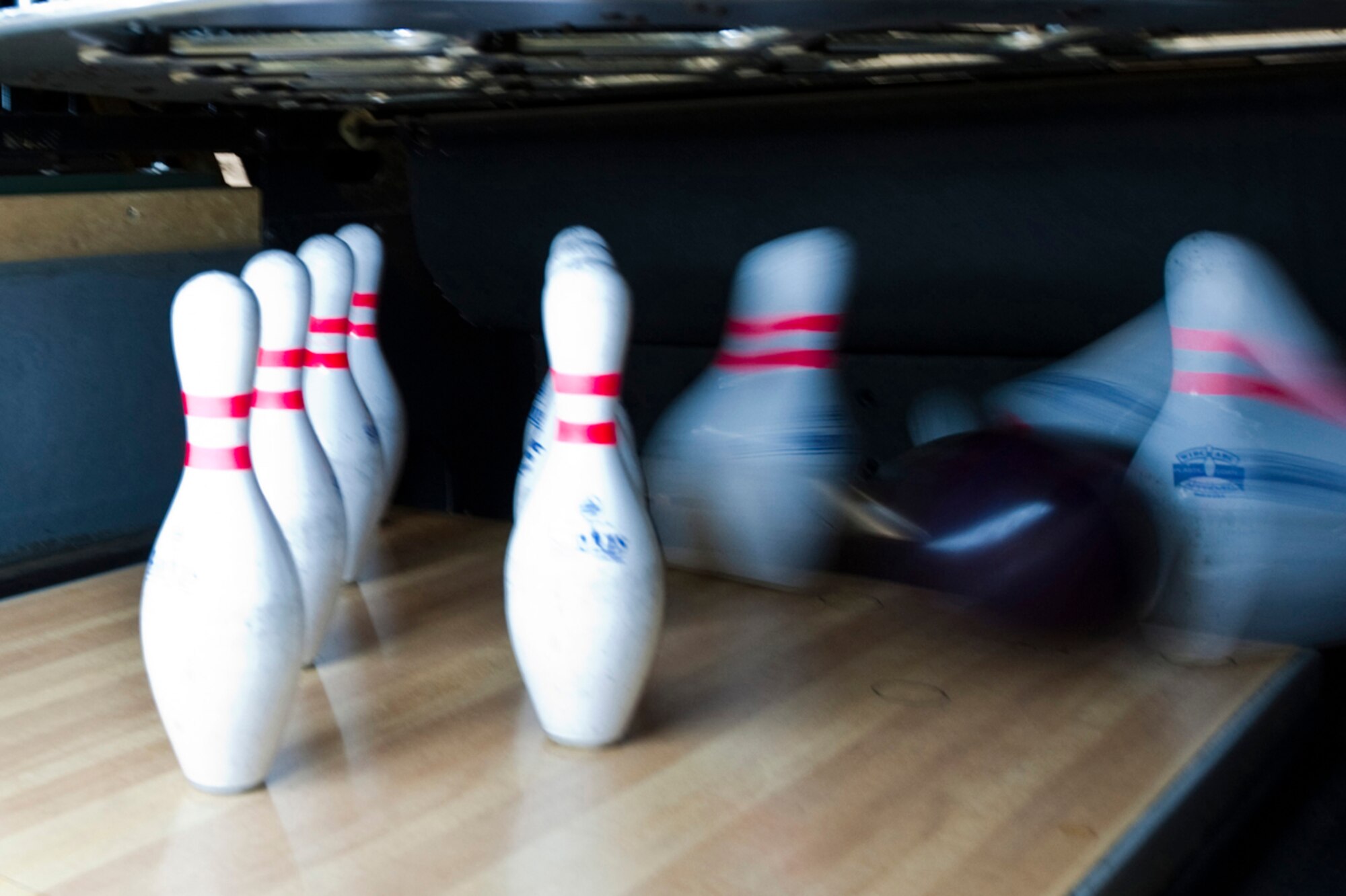 JOINT BASE ELMENDORF-RICHARDON, Alaska - Pins get knocked around during Big Brothers Big Sisters of Alaska?s Bowl for Kids Sake at JBER?s Polar Bowl April 8. The event helped raised money for the organization and will be used toward children matched with BBBS. (U.S. Air Force photo/Senior Airman Christopher Gross)