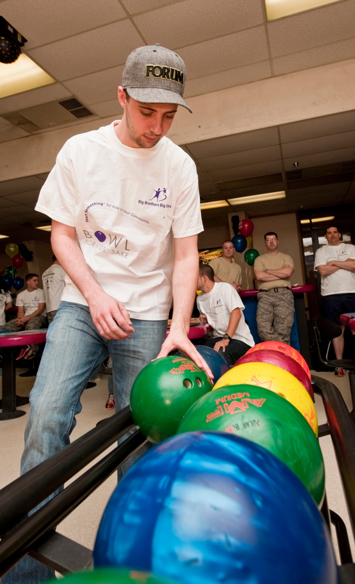JOINT BASE ELMENDORF-RICHARDON, Alaska - Keegan Bruce picks up a bowling ball during Big Brothers Big Sisters of Alaska's Bowl for Kids Sake at JBER?s Polar Bowl April 8. The event helped raised money for the organization and will be used toward children matched with BBBS. Bruce is an airman with the 673d Inpatient Squadron. (U.S. Air Force photo/Senior Airman Christopher Gross)