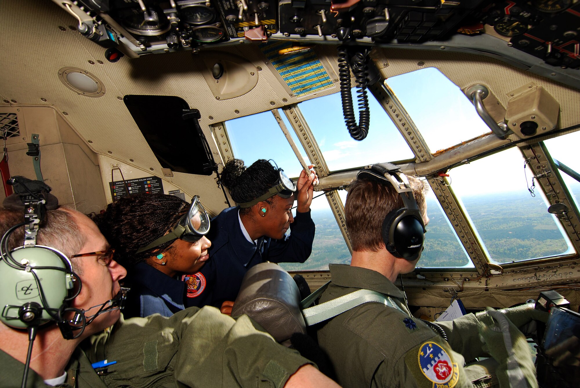 Atlanta area Air Force Junior Reserve Officer Training Corps cadets get a great view over the shoulder of C-130H2 pilot during a short familiarization flight, Apr 13.  The 94th Airlift Wing and Dobbins Air Reserve Base hosted approximately 1,500 high school JROTC cadets for a look at the Wing and a C-130H2 Hercules flight.   (U.S. Air Force photo/ Brad Fallin)