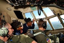 Atlanta area Air Force Junior Reserve Officer Training Corps cadets get a great view over the shoulder of C-130H2 pilot during a short familiarization flight, Apr 13.  The 94th Airlift Wing and Dobbins Air Reserve Base hosted approximately 1,500 high school JROTC cadets for a look at the Wing and a C-130H2 Hercules flight.   (U.S. Air Force photo/ Brad Fallin)