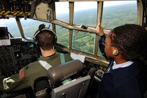 An Atlanta area Air Force Junior Reserve Officer Training Corps cadet gets a birds- eye-view from behind the co-pilot of a C-130H2 cargo aircraft during a short familiarization flight, Apr 13.  The 94th Airlift Wing and Dobbins Air Reserve Base hosted approximately 1,500 high school JROTC cadets for a look at the Wing and a C-130H2 Hercules flight.   (U.S. Air Force photo/ Brad Fallin)