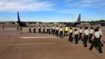 Army Junior Reserve Officer Training Corps cadets from the Atlanta regional area march out to an awaiting C-130H2 Hercules aircraft for a short familiarization flight, Apr 13.  The 94th Airlift Wing and Dobbins Air Reserve Base hosted more than 1,500 high school JROTC cadets for a look at the Wing and a C-130H2 Hercules flight.   (U.S. Air Force photo/ Brad Fallin)