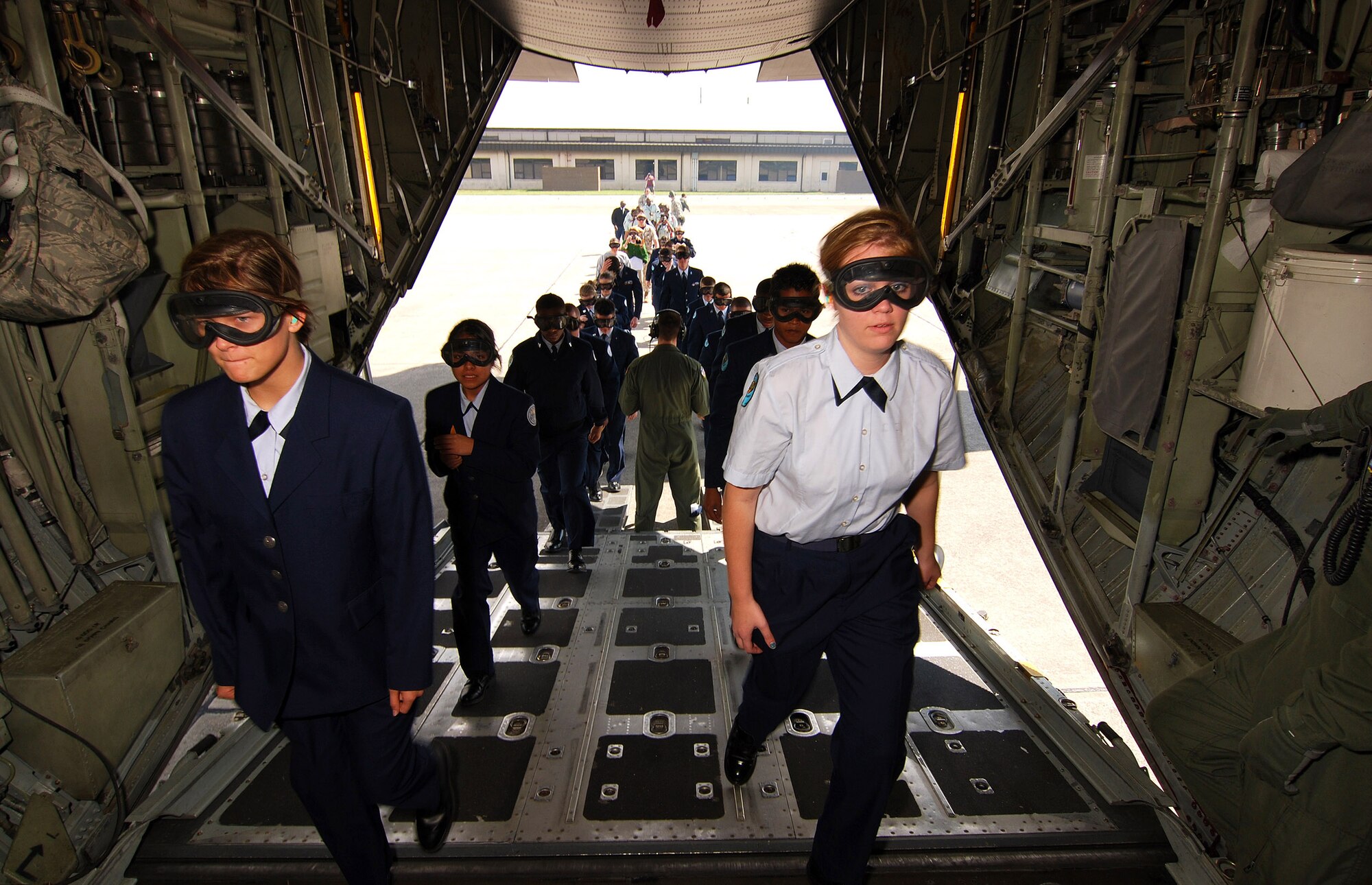 Air Force Junior Reserve Officer Training Corps cadets from the Atlanta regional area board a C-130H2 Hercules aircraft for a short familiarization flight, Apr 12.  The 94th Airlift Wing and Dobbins Air Reserve Base hosted more than 1,500 high school JROTC cadets for a look at the Wing and a flight on a C-130H2 Hercules.   (U.S. Air Force photo/ Brad Fallin)