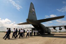 Air Force Junior Reserve Officer Training Corps cadets from the Atlanta regional area disembark from a C-130H2 Hercules aircraft after a short familiarization flight, Apr 12.  The 94th Airlift Wing and Dobbins Air Reserve Base hosted more than 1,500 high school JROTC cadets for a look at the Wing and a flight on a C-130H2 Hercules.   (U.S. Air Force photo/ Brad Fallin)