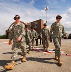 Army Junior Reserve Officer Training Corps cadets from the Atlanta regional area eagerly march out to an awaiting C-130H2 Hercules aircraft for a short familiarization flight, Apr 12.  The 94th Airlift Wing and Dobbins Air Reserve Base hosted more than 1,500 high school JROTC cadets for a look at the Wing and a C-130H2 Hercules flight.   (U.S. Air Force photo/ Brad Fallin)