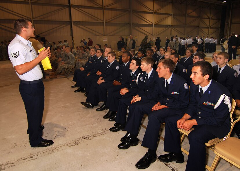 Staff Sgt. Anthony Toste, 700th Airlift Squadron, Loadmaster, provides a C-130H2 safety briefing to Junior Reserve Officer Training Corps cadets from the Atlanta regional area prior to their flight, Apr 12.  The 94th Airlift Wing and Dobbins Air Reserve Base hosted more than 1,500 high school JROTC cadets for a look at the Wing and a familiarization flight on a C-130H2 Hercules cargo aircraft.   (U.S. Air Force photo/ Brad Fallin)