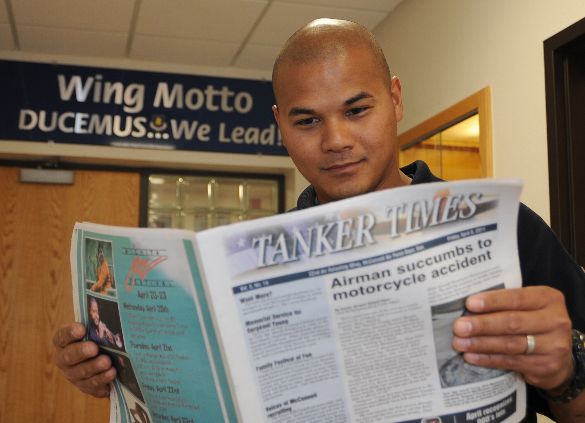Sean Villagomez, 22nd Civil Engineer Squadron fire inspector, reads the Tanker Times April 13, 2011, McConnell Air Force Base, Kan. Due to increasing popularity of web-based news sites and continuing deployment demands, the last issue of the Tanker Times is set for April 29, 2011. McConnell’s official website and Facebook site will now carry all the base news and information. (U.S. Air Force Photo/Airman 1st Class Katrina M. Brisbin)