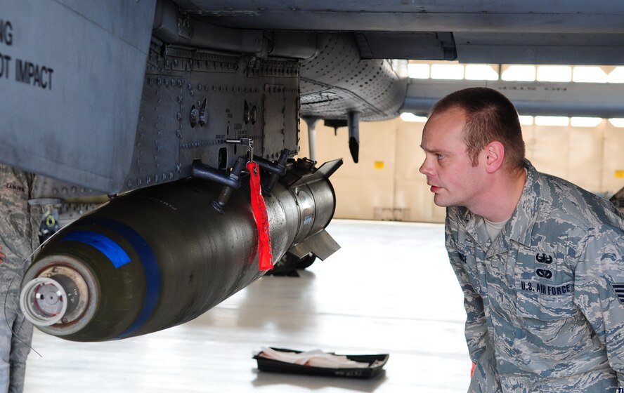 Staff Sgt. Ryan Prince, 23rd Civil Engineer Squadron explosive ordnance disposal journeyman, visually assesses the status of the Mark 82 bomb to develop a plan for him and his team during emergency crisis training April 12 at Moody Air Force Base, Ga. The training will go toward Sergeant Prince’s upgrade to an EOD craftsman. (U.S. Air Force photo/Senior Airman Stephanie Mancha)(RELEASED)