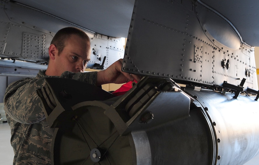 Staff Sgt. Ryan Prince, 23rd Civil Engineer Squadron explosive ordnance disposal journeyman, safeguards munitions on an A-10C Thunderbolt II during emergency crisis training April 12 at Moody Air Force Base, Ga. Sergeant Prince was the team leader for a three-man emergency response team that responded to a simulated bird strike to the aircraft. (U.S. Air Force photo/Senior Airman Stephanie Mancha)(RELEASED)
