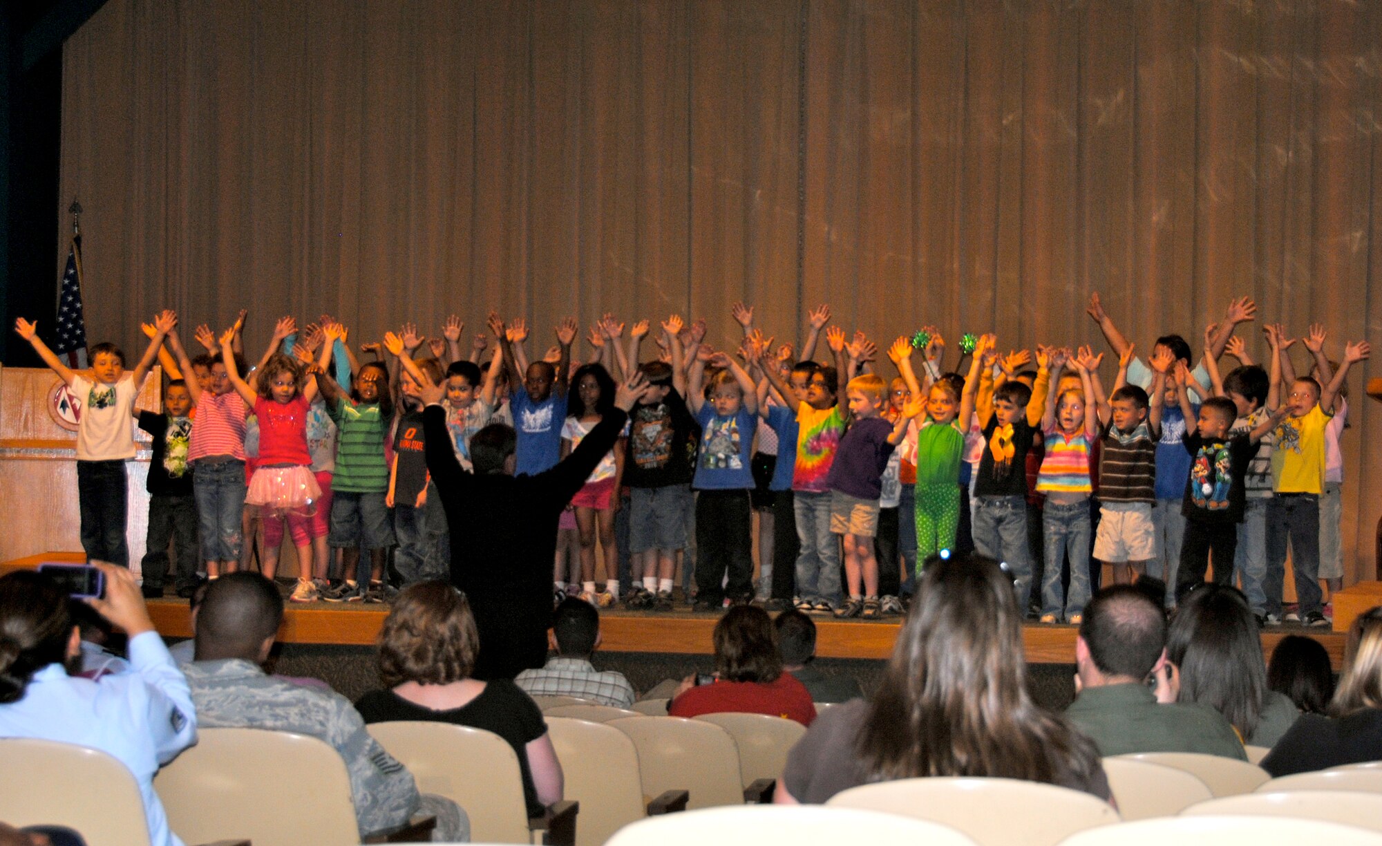 Students from Eisenhower Elementary school and the base Child Development Center performed several songs during the Vance AFB Arbor Day celebration April 11 in the Base Auditorium. (U.S. Air Force photo/ 2nd Lt. Kiersten Thompson)