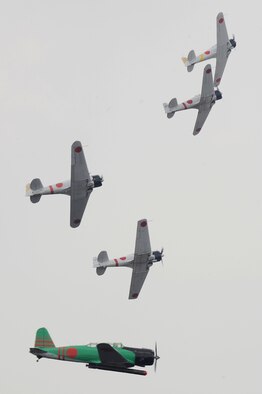 Aircraft painted like WWII Japanese Zeros simulate the Dec. 7, 1941 attack on Pearl Harbor during the Tora! Tora! Tora! performance at the Charleston Air Expo 2011 April 9. Nearly 80,000 people attended the event to experience more than a dozen aerial performances as well as numerous static aircraft displays. (U.S. Air Force photo by Tech. Sgt. Chrissy Best)