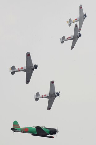 Aircraft painted like WWII Japanese Zeros simulate the Dec. 7, 1941 attack on Pearl Harbor during the Tora! Tora! Tora! performance at the Charleston Air Expo 2011 April 9. Nearly 80,000 people attended the event to experience more than a dozen aerial performances as well as numerous static aircraft displays. (U.S. Air Force photo by Tech. Sgt. Chrissy Best)
