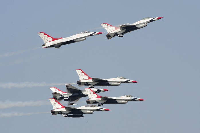 The U.S. Air Force Thunderbirds team performs a breakaway aerial maneuver during the Charleston Air Expo 2011 Apr. 9. The Thunderbirds demonstrated their precision flying for nearly 80,000 people during the Expo. (U.S. Air Force photo by Tech. Sgt. Chrissy Best)
