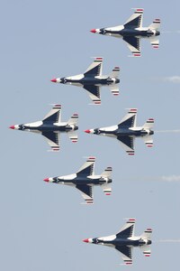 The U.S. Air Force Thunderbirds team performs a pass across airshow central during the Charleston Air Expo 2011 Apr. 9. The Thunderbirds demonstrated their precision flying for nearly 80,000 people during the Expo. (U.S. Air Force photo by Tech. Sgt. Chrissy Best)