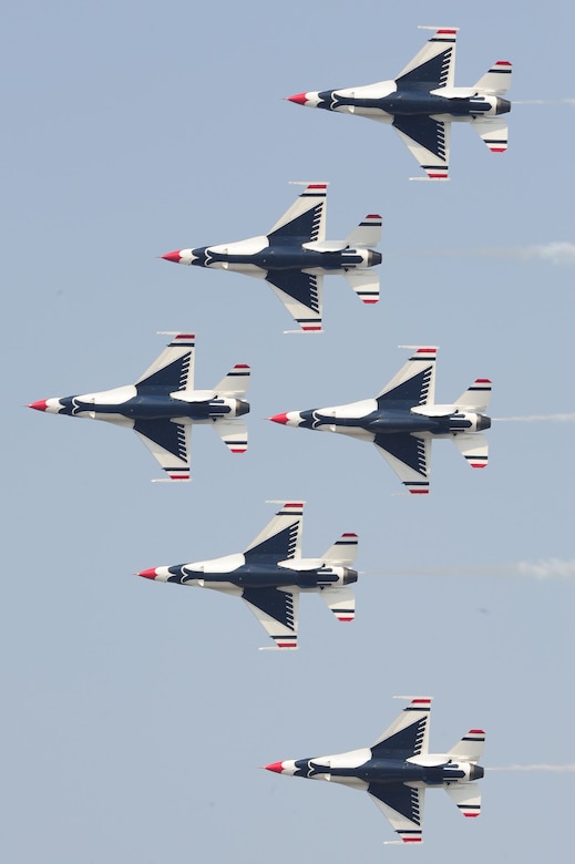 The U.S. Air Force Thunderbirds team performs a pass across airshow central during the Charleston Air Expo 2011 Apr. 9. The Thunderbirds demonstrated their precision flying for nearly 80,000 people during the Expo. (U.S. Air Force photo by Tech. Sgt. Chrissy Best)
