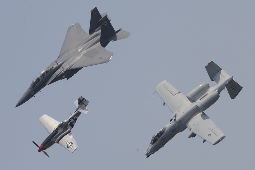 The F-15E Strike Eagle , The P-51D Mustang, and the A-10 Thunderbolt II fly in formation during the Charleston Air Expo 2011 Apr. 9. All the demonstrators showed their precision flying for nearly 80,000 people during the Expo. The three aircraft represent more than 60 years of US military air superiority. (U.S. Air Force photo by Tech. Sgt. Chrissy Best)
