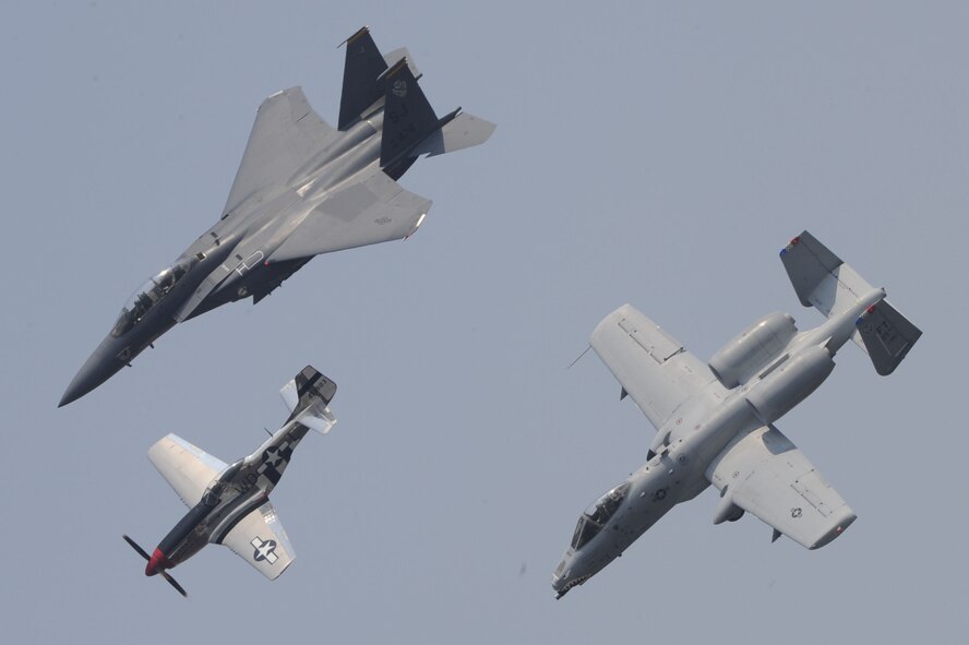 The F-15E Strike Eagle, P-51D Mustang and A-10 Thunderbolt II fly in formation during the Charleston Air Expo 2011 on April 9, 2011, at Joint Base Charleston, S.C. All the demonstrators showed their precision flying for nearly 80,000 people during the Expo. The three aircraft represent more than 60 years of US military air superiority. (U.S. Air Force Photo/Tech. Sgt. Chrissy Best)