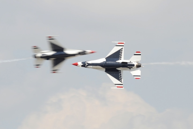The U.S. Air Force Thunderbirds team performs an aerial maneuver during the Charleston Air Expo 2011 Apr. 9. The Thunderbirds demonstrated their precision flying for nearly 80,000 people during the Expo. (U.S. Air Force photo by Tech. Sgt. Chrissy Best)