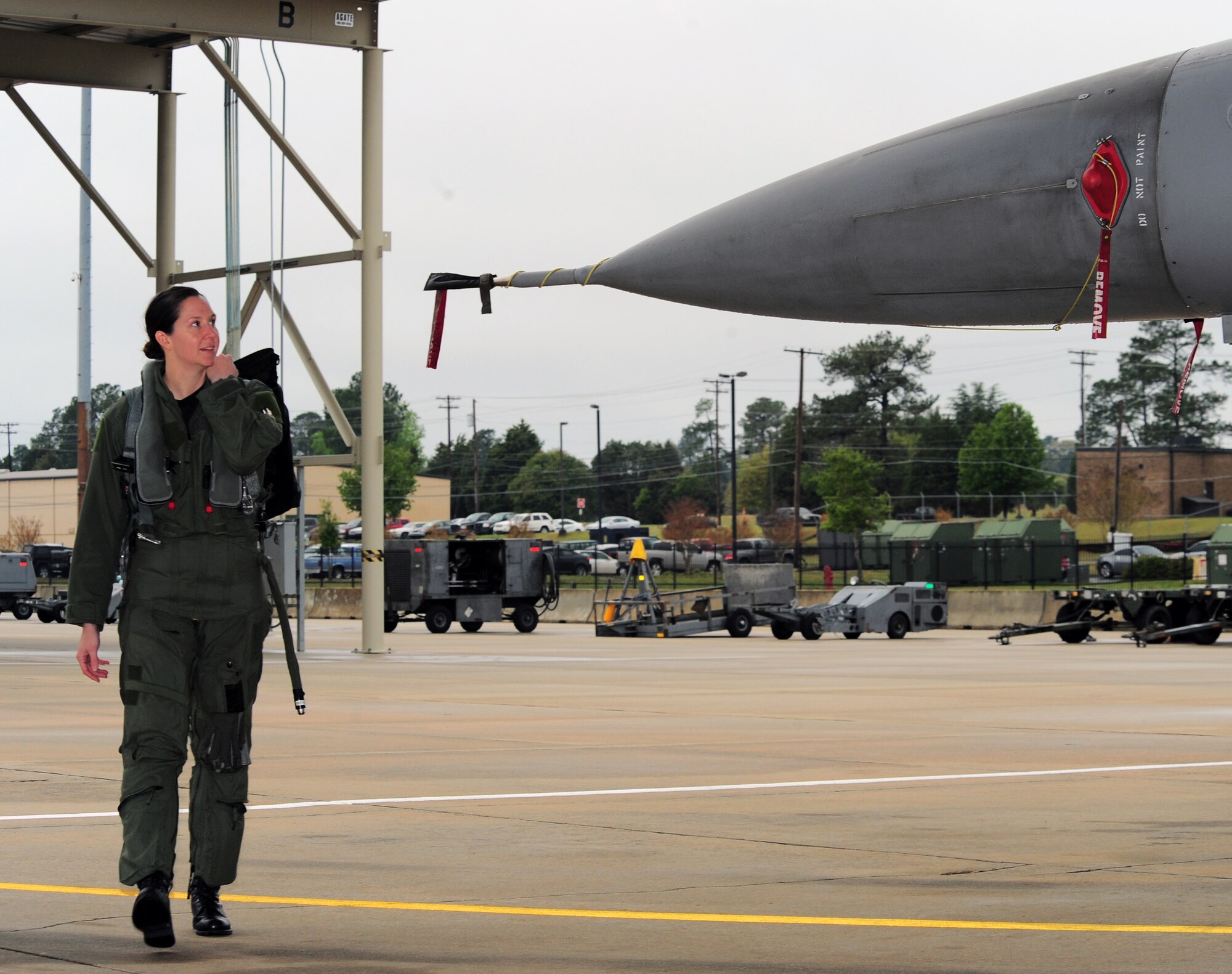 SHAW AIR FORCE BASE, S.C. -- Capt. Betsy Hand, 20th Operations Group standard evaluations liaison officer and 77th Fighter Squadron F-16 pilot, walks up to an F-16 to perform a pre-flight inspection March 30, 2011. The Air Force has had women in fighter pilot roles since 1993.(U.S. Air Force photo/ Airman 1st Class Daniel Phelps)