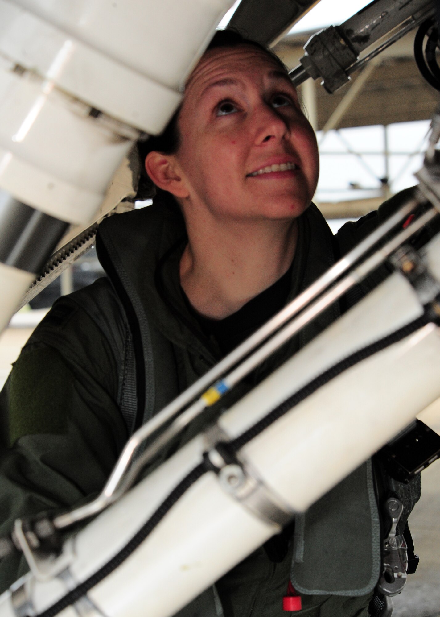 SHAW AIR FORCE BASE, S.C. -- Captain Betsy Hand, 20th Operations Group standard evaluations liason officer and 77th Fighter Squadron F-16 pilot, inspects an F-16 March 30, 2011. The Air Force has had women in fighter pilot roles since 1993.(U.S. Air Force photo/ Airman 1st Class Daniel Phelps)