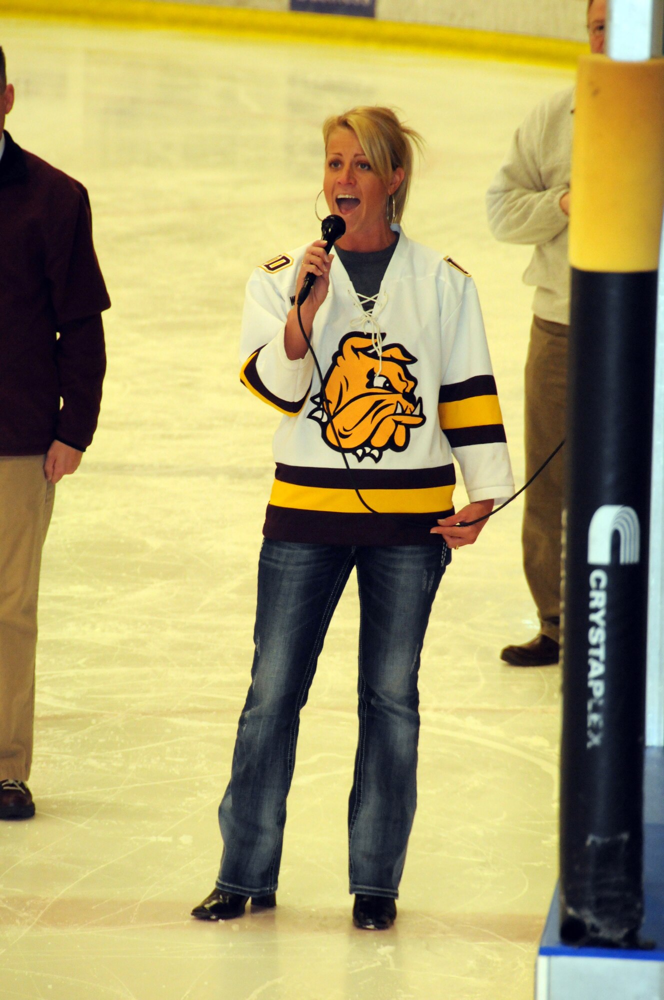 1st Lt. Jodi Kiminski of the 148th Fighter Wing, Duluth, Minn. sings the National Anthem before the start of the 2011 Minnesota National Guard Hockey Tournament.  The tournament was held at the Duluth Heritage Sports Center in Duluth, Minn.  (U.S. Air Force photo by Master Sgt. Ralph J. Kapustka)