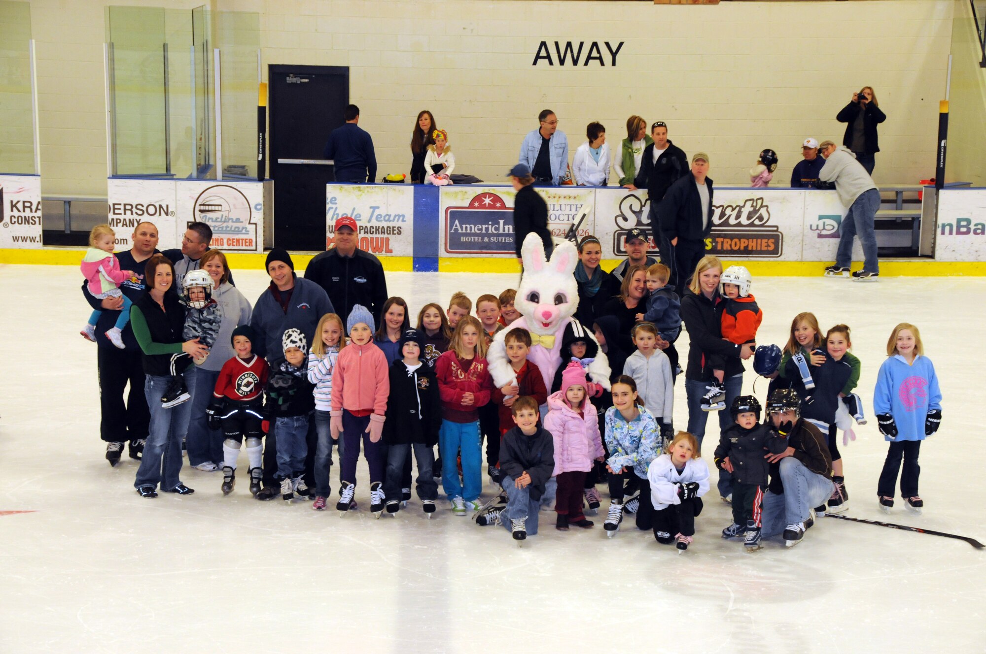 Minnesota National Guard families pose for a group picture with the Easter Bunny while attending the Minnesota National Guard Hockey Tournament.  The tournament was held at the Duluth Heritage Sports Center in Duluth, Minn.  (U.S. Air Force photo by Master Sgt. Ralph J. Kapustka)