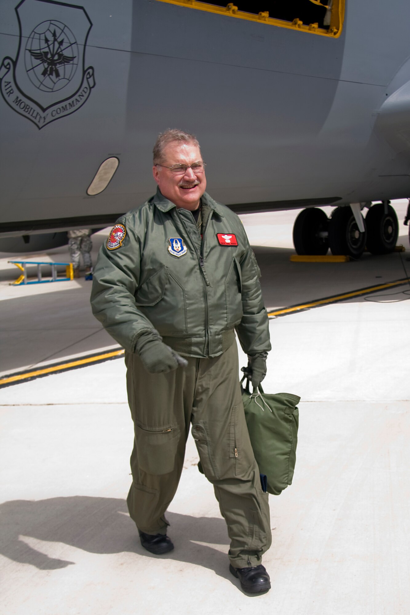 GRISSOM AIR RESERVE BASE, Ind. --  Senior Master Sgt. Paul "Doogie" Houser, 434th Operations Support Squadron in-flight refueling manager, steps away from a KC-135R Stratotanker here  shortly after completing his 10,000th flight hour April 5. Friends, family and coworkers gathered together to congratulate Sergeant Houser, who began his Air Force career in 1976 as a communications and navigation maintenance specialist. He cross trained to be an in-flight refueling technician, better known as a boom operator, in 1980 and joined the Air Force Reserve in 1985. (U.S. Air Force photo/Tech. Sgt. Mark R. W. Orders-Woempner)