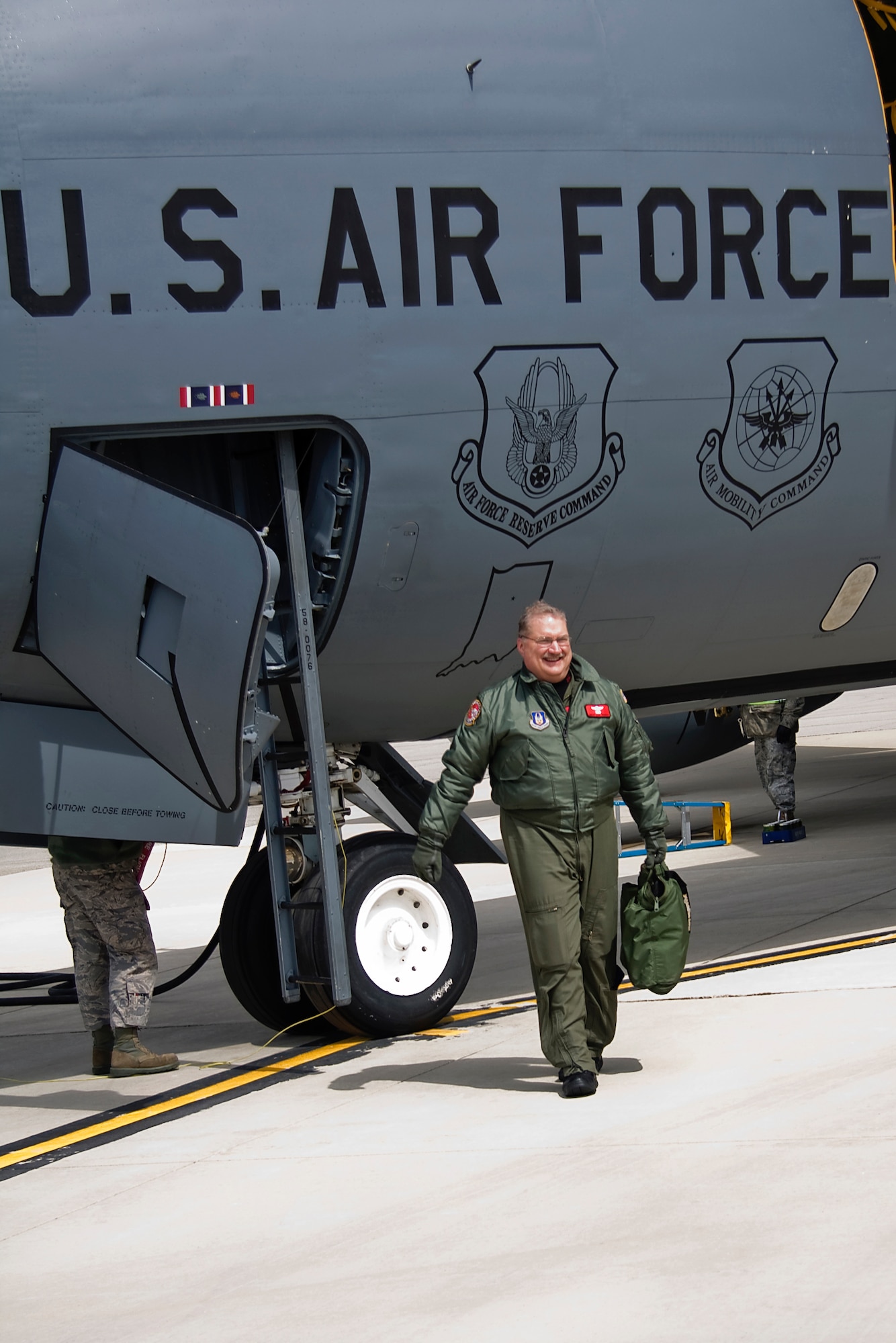 GRISSOM AIR RESERVE BASE, Ind. --  Senior Master Sgt. Paul "Doogie" Houser, 434th Operations Support Squadron in-flight refueling manager, steps away from a KC-135R Stratotanker here  shortly after completing his 10,000th flight hour April 5. Friends, family and coworkers gathered together to congratulate Sergeant Houser, who began his Air Force career in 1976 as a communications and navigation maintenance specialist. He cross trained to be an in-flight refueling technician, better known as a boom operator, in 1980 and joined the Air Force Reserve in 1985. (U.S. Air Force photo/Tech. Sgt. Mark R. W. Orders-Woempner)