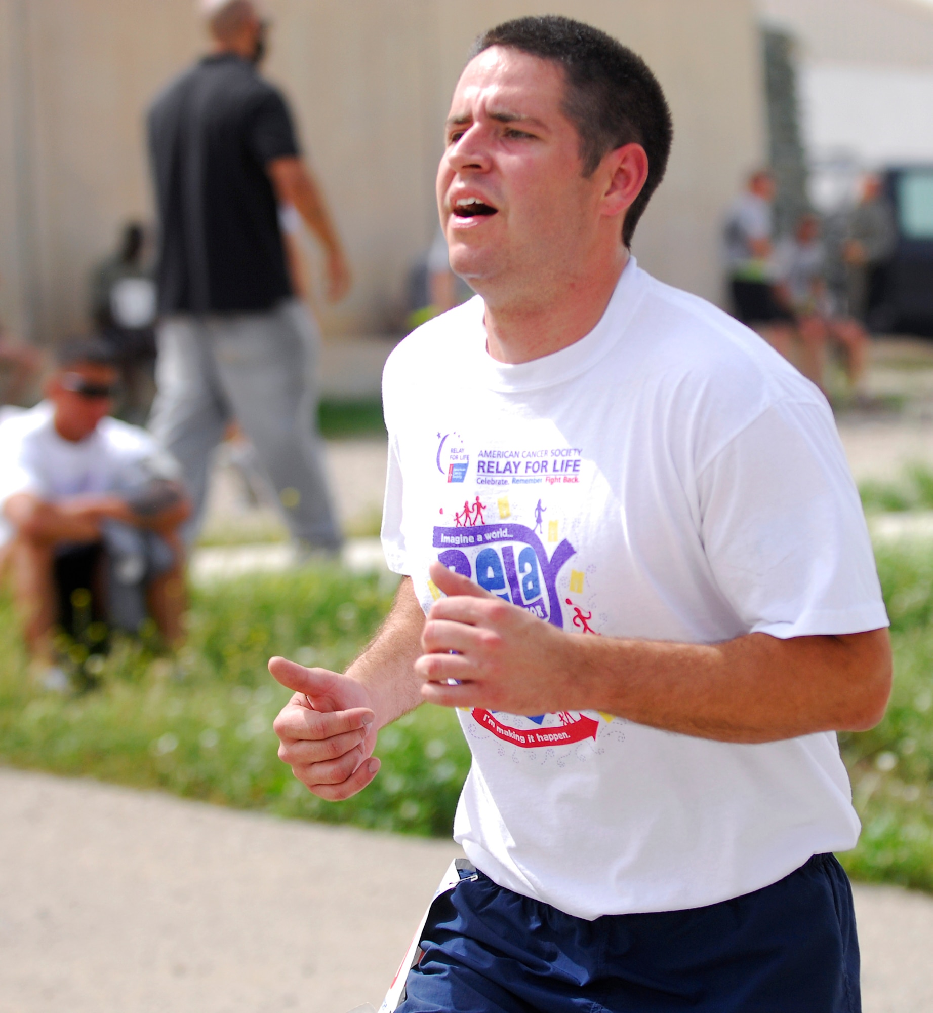 Staff Sgt. Tyler McInturff finishes the Relay for Life 5K April 2, 2011, at Kirkuk Regional Air Base, Iraq. Sergeant McInturff organized the run, raising nearly $4,000 for the American Cancer Society. He is assigned to the 321st Expeditionary Logistics Readiness Squadron. (Courtesy photo) 