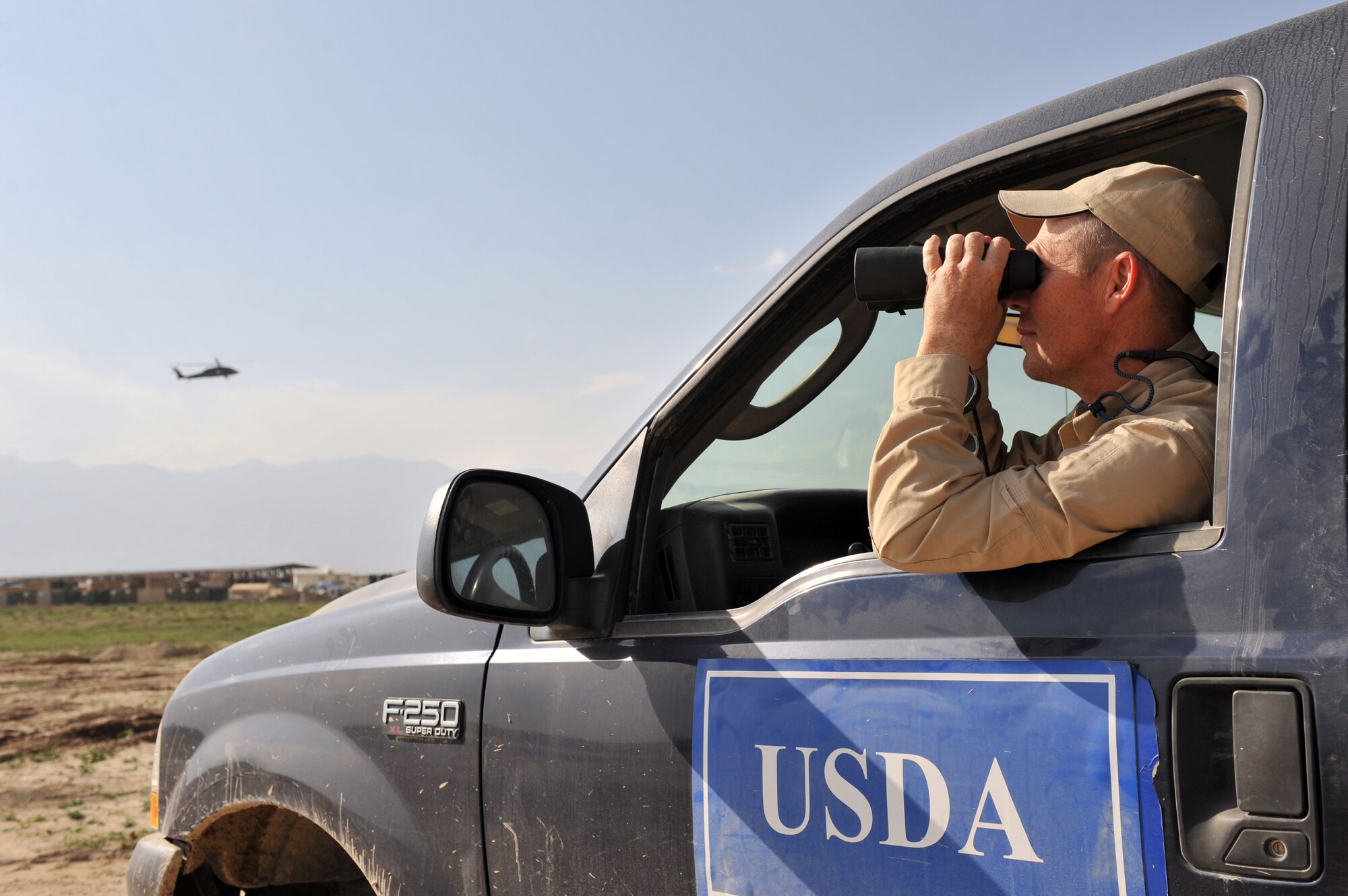 Mr. Eddie Earwood, U.S. Department of Agriculture Wildlife Services biologist, assess the airfield for birds at Bagram Airfield, Afghanistan, April 13, 2011. Mr. Earwood, assigned to the 455th Air Expeditionary Wing Safety, routinely checks different locations on and around the flightline to ensure there are no birds or varmints that can potentially be a safety hazards.  (U.S. Air Force photo by Senior Airman Sheila deVera)